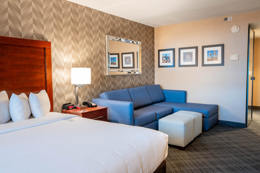 Comfort Inn & Suites Logan International Airport guest room with bed and seating area