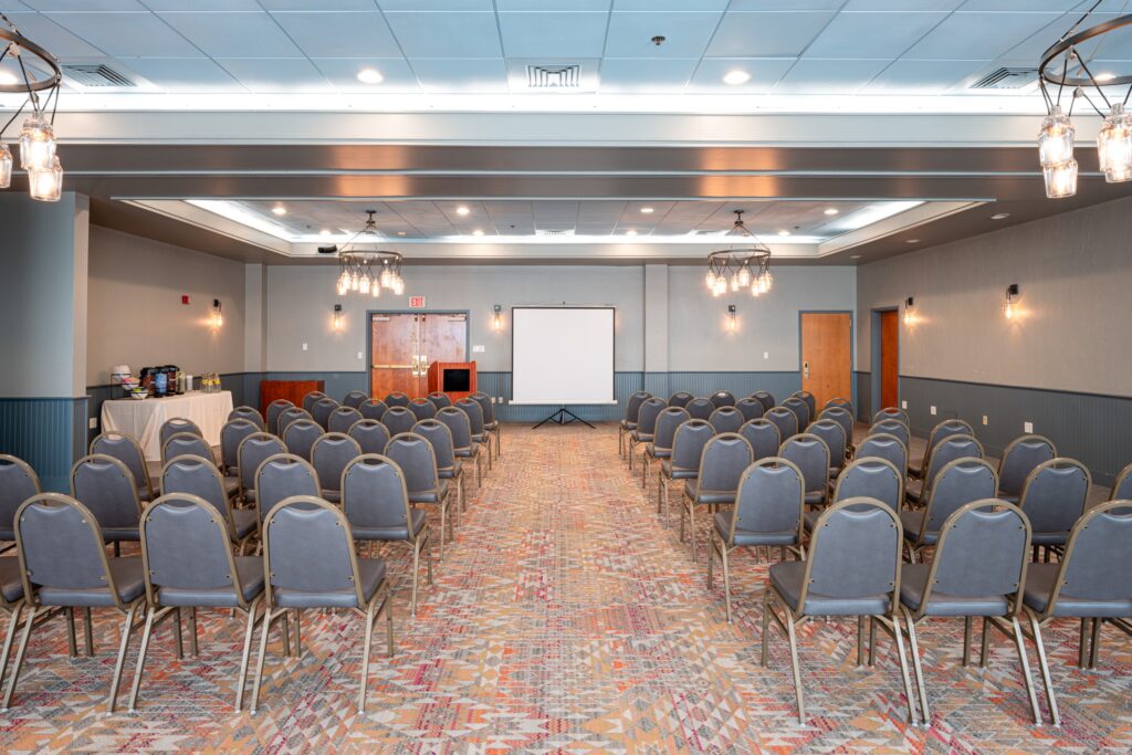 meeting room set theater style with rows of chairs facing a projector screen, Comfort Inn & Suites Logan International Airport