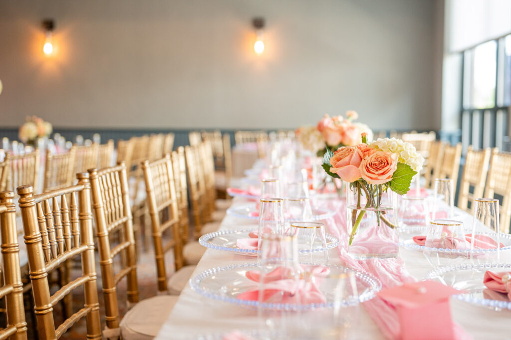 banquet table set with gold chairs, glassware and pink floral centerpieces, Comfort Inn & Suites Logan International Airport